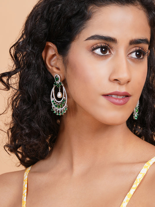 Green AD chandbali earrings with pearl drop, styled against green saree