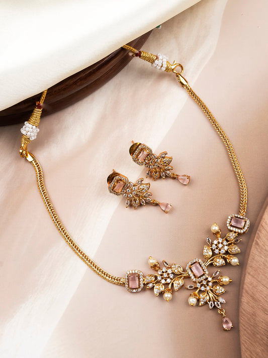 Gold plated pink AD stone flower necklace styled with pastel gown