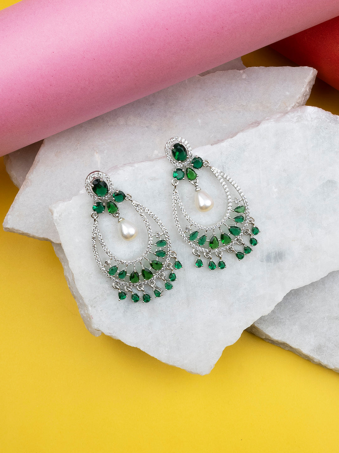 Green AD chandbali earrings with pearl drop, styled against green saree