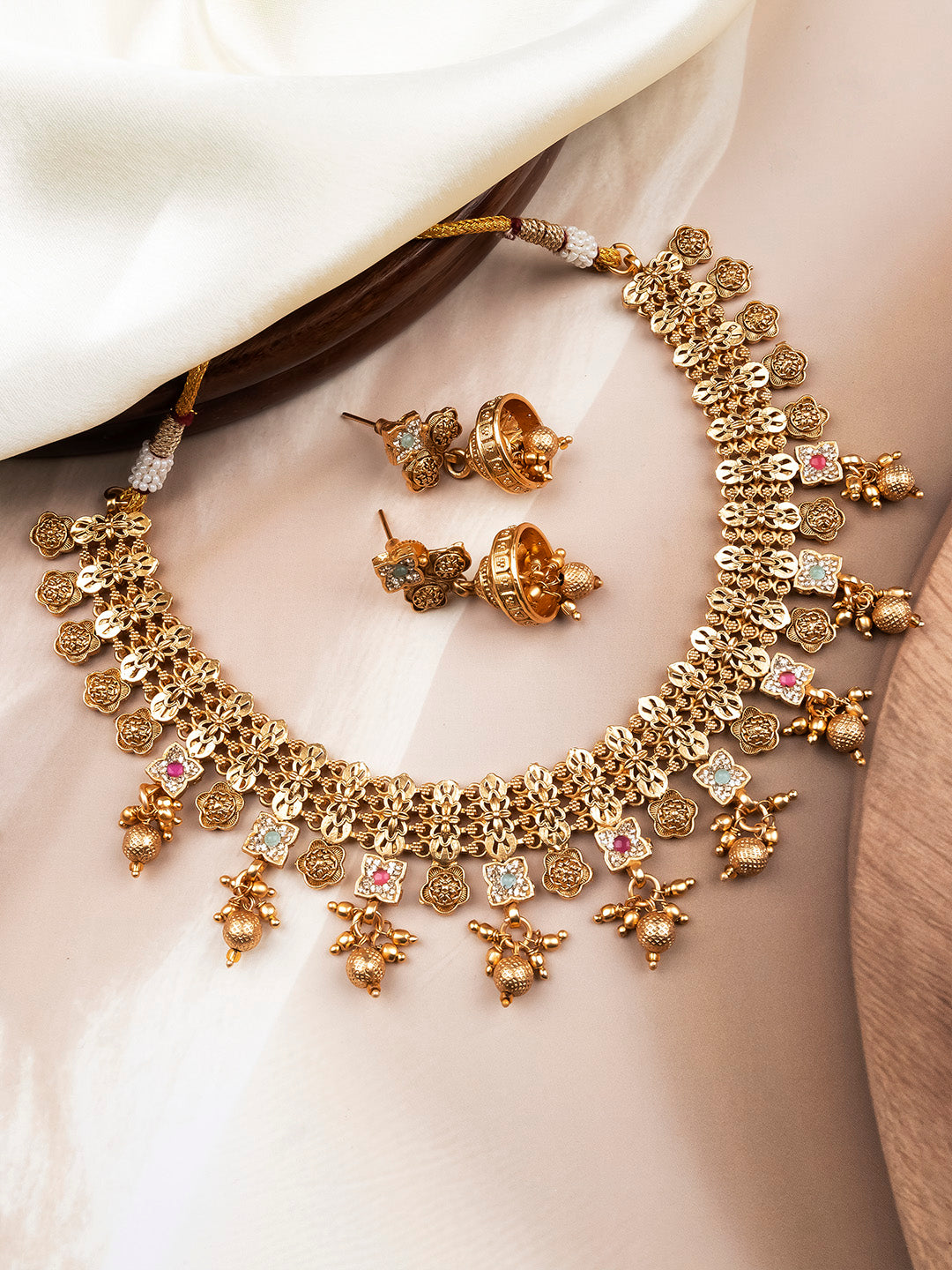 Antique gold floral motif necklace with ruby and mint stone accents