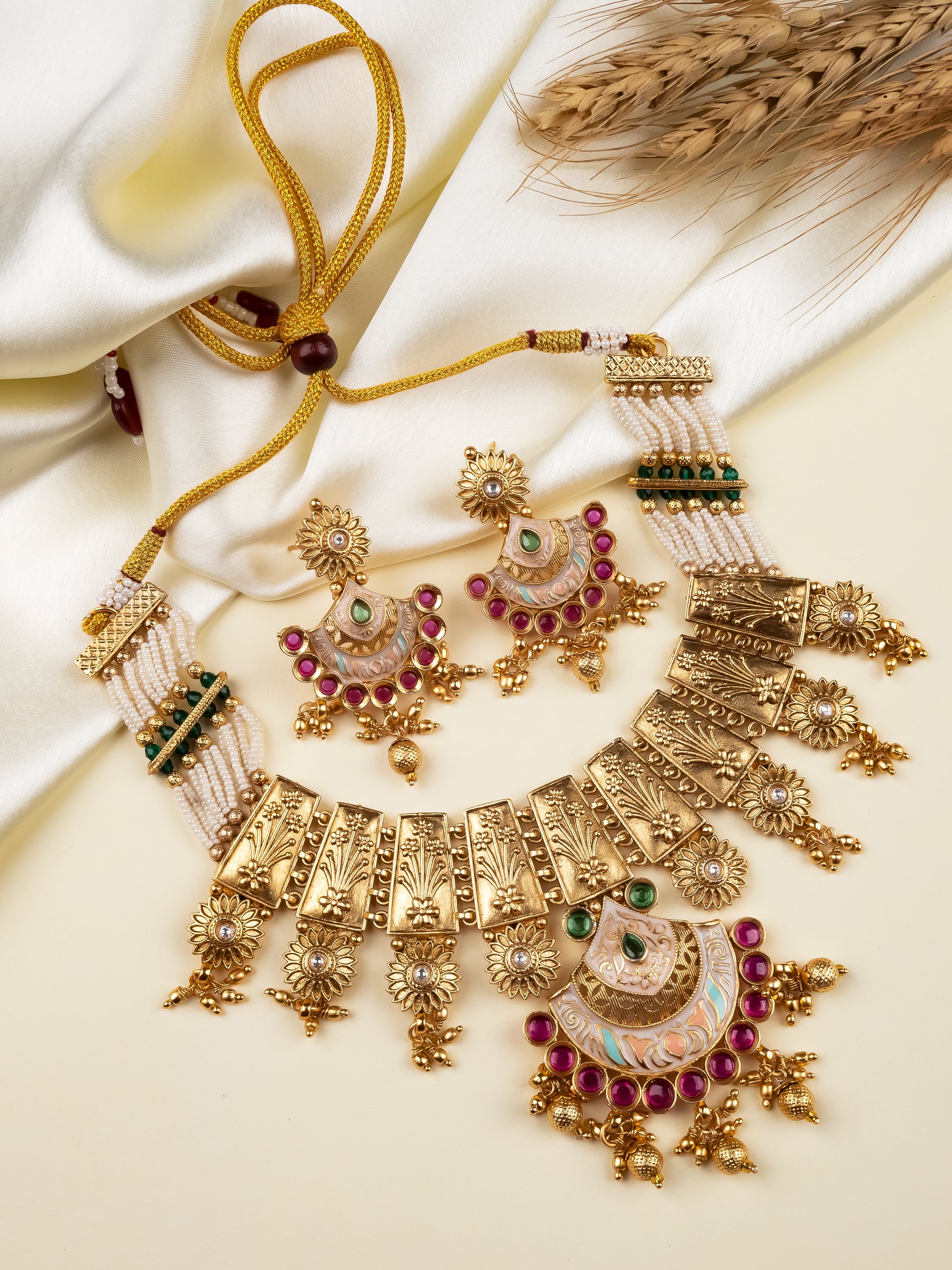 Antique gold meenakari panel fringe necklace with sunflower motifs and matching earrings