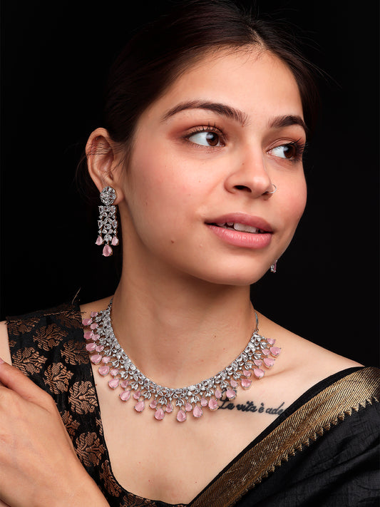 Woman wearing Silver-toned pink AD CZ floral necklace set with teardrop drops and matching earrings